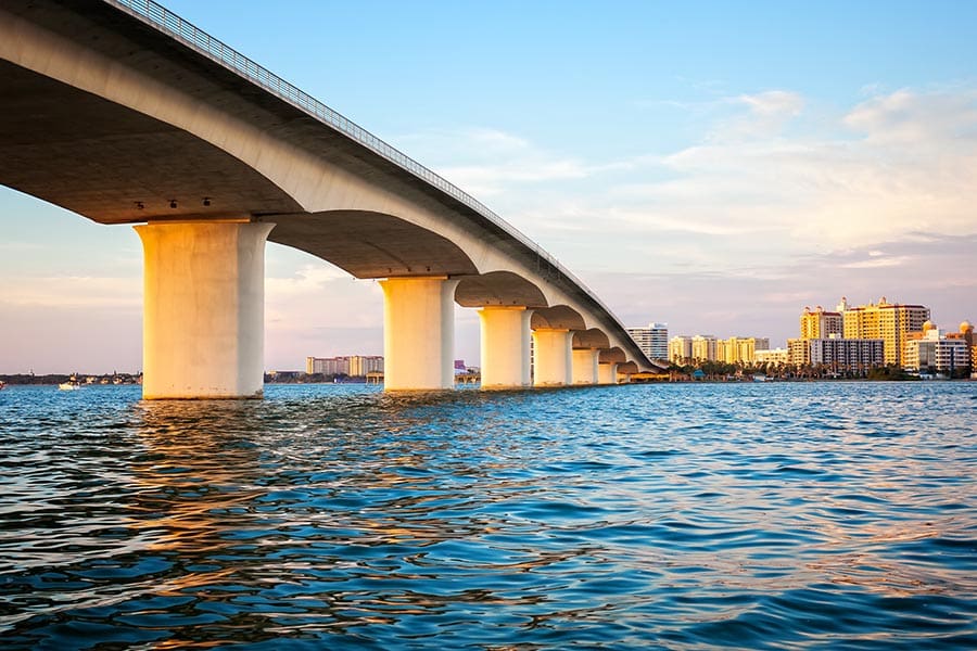 Sarasota, FL Insurance - View From the Water Under Ringling Bridge at Dusk, the Sky Turning Pink at Sunset